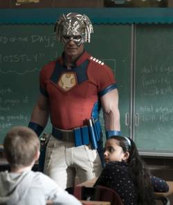 Peacemaker talking to a classroom of children
